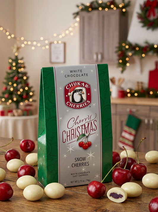 Box of Chilkat Cherries Christmas Snow Cherries with white and red cherries on a festive background.