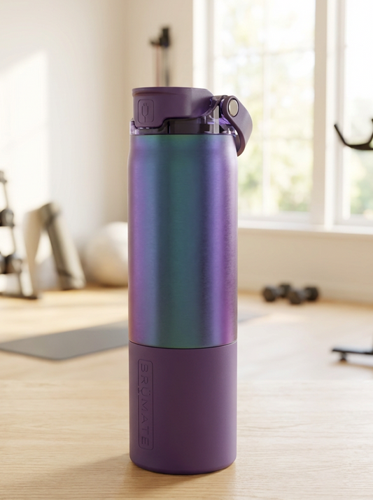 Purple water bottle on a wooden floor with gym equipment in the background