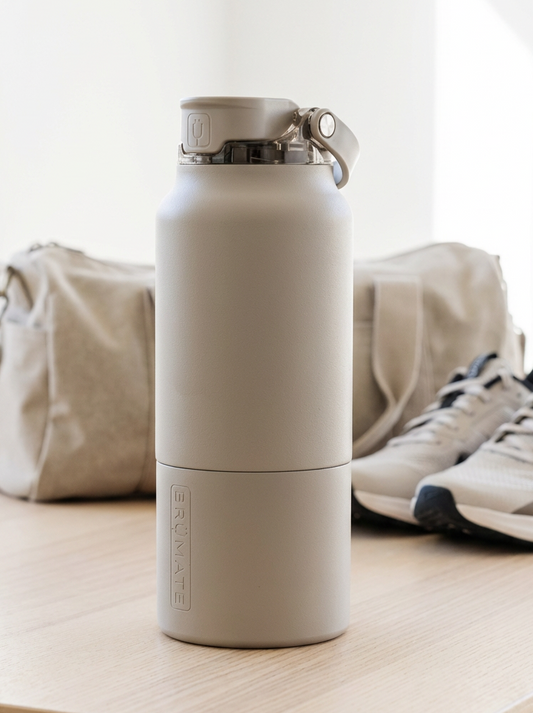 Beige water bottle on a wooden surface with a white background