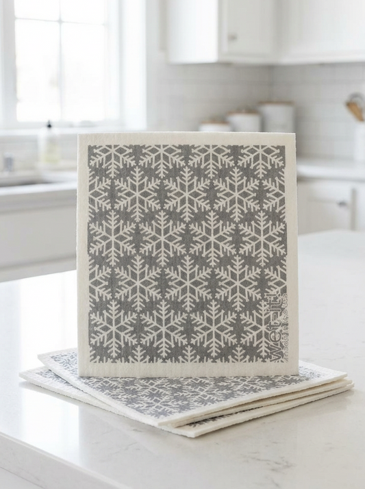 Set of coasters with snowflake pattern on a white surface